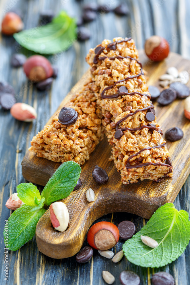 Fototapeta premium Candied cereal bars with nuts and chocolate.
