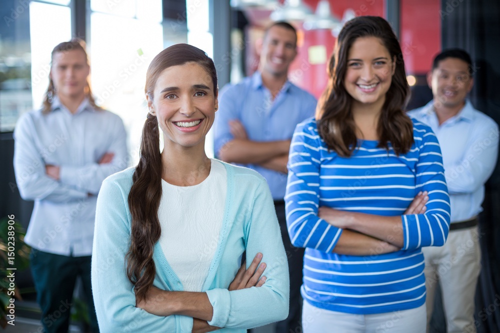 Obraz premium Portrait of businesspeople standing with arms crossed