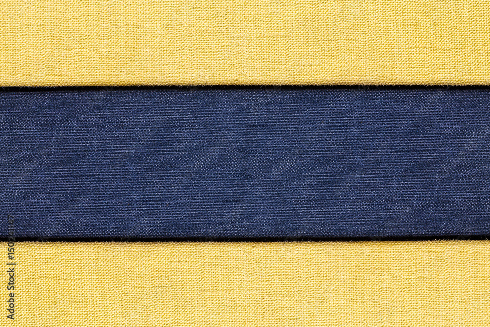 Fototapeta premium Blue and yellow checkered canvas fabric material. Empty copy space background.