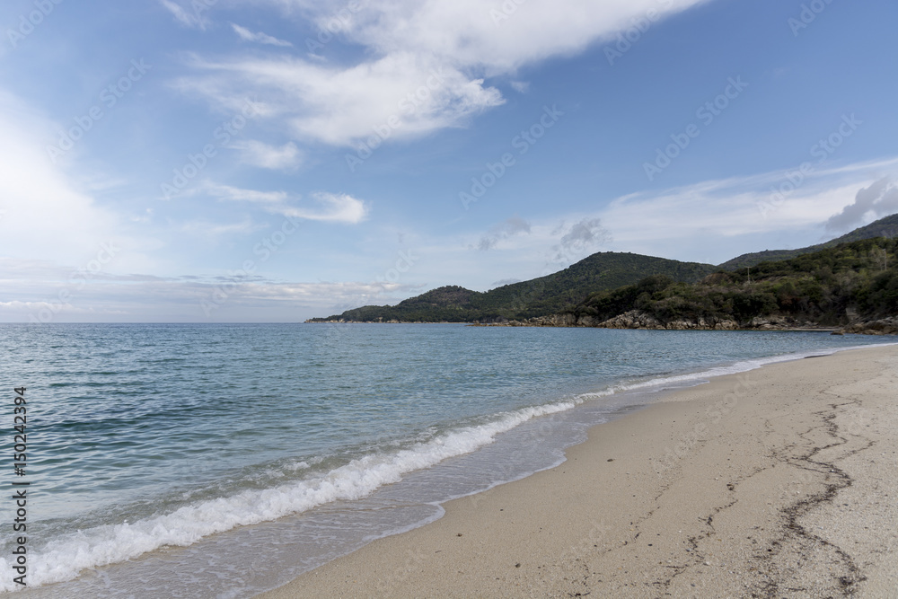 Landscape with sea view, waves, rocks and sea shells, clouds, photographed in Greece