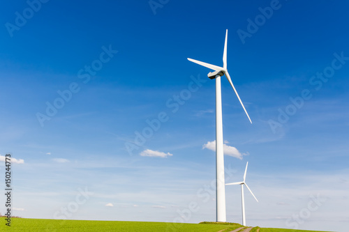 Wind turbine with blue sky - renewable energy