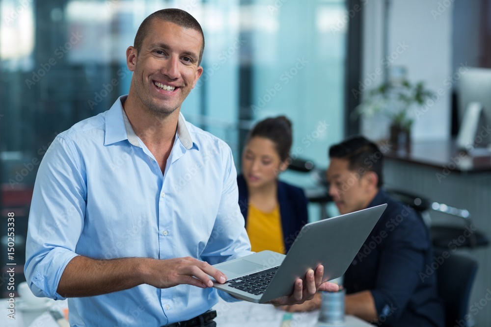Male business executive using laptop Male business executive using laptop