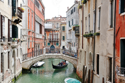 Venice, Italy - picturesque view of a canal, buildings, gondola and bridge