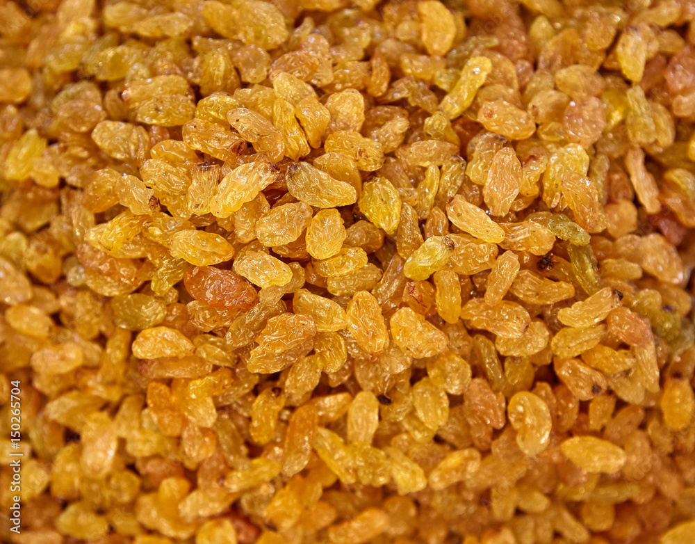 Raisins Background. Yellow Sultanas. Golden Dried Seedless Grapes Top View Raisins Background. Yellow Sultanas. Golden Dried Seedless Grapes Top View