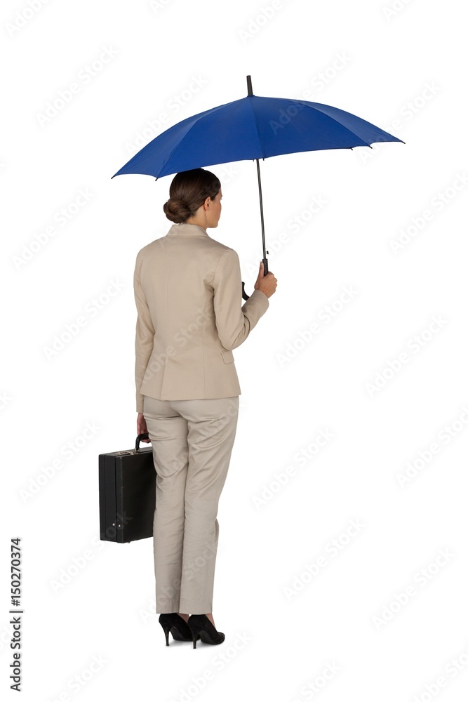 Businesswoman holding blue umbrella and a briefcase Businesswoman holding blue umbrella and a briefcase