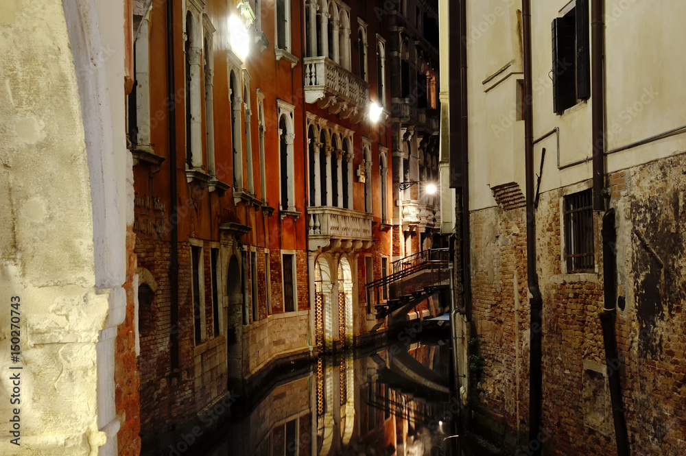 Night view of a canal in Venice, Italy