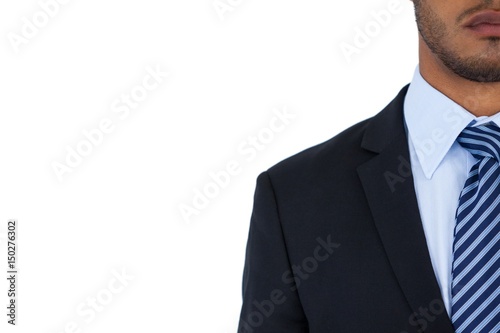 Businessman standing against white background