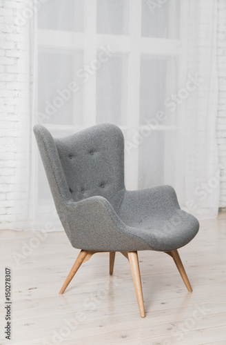 Gray armchair in the interior