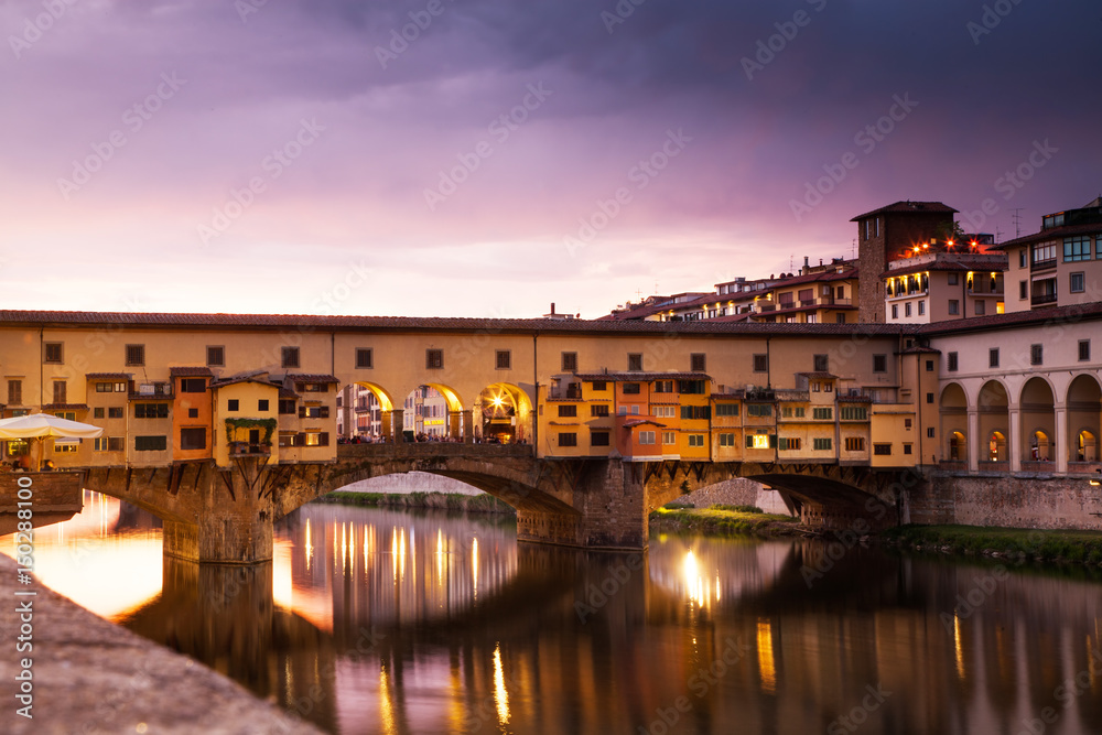 sunset above Ponte Vecchio - Old Bridge view from Arno river bank