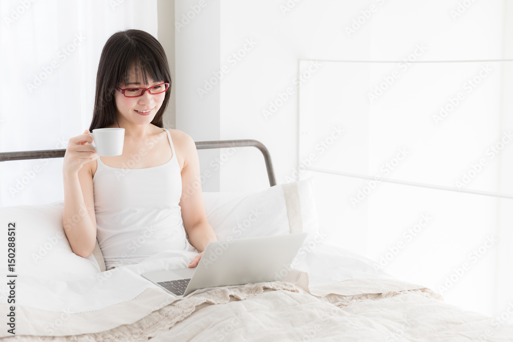 attractive asian woman relaxing in bedroom attractive asian woman relaxing in bedroom