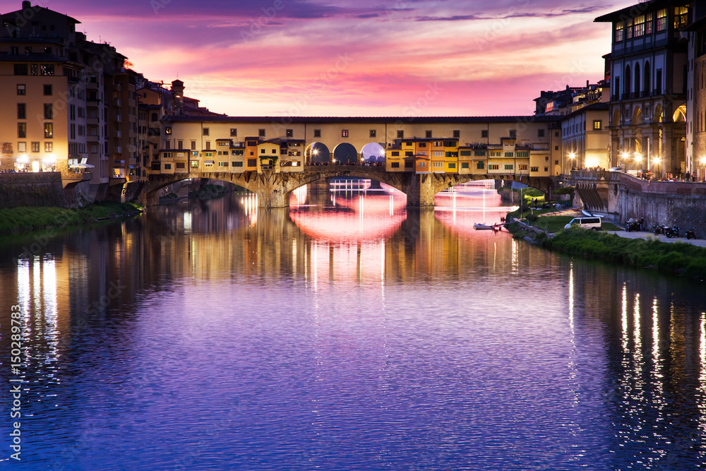 Fototapeta premium sunset above Ponte Vecchio - Old Bridge view from Arno river bank