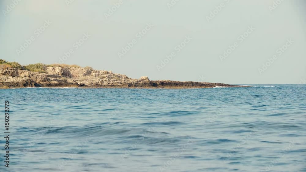 stone shore at sea on Sunny summer day. stone shore at sea on Sunny summer day.