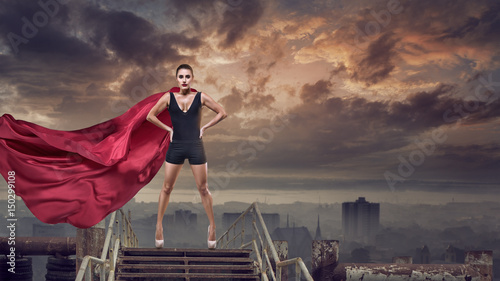 Super woman with red cape photo