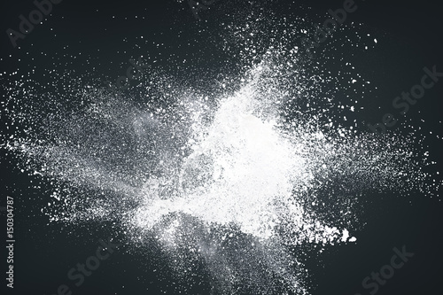 Abstract white powder against dark background