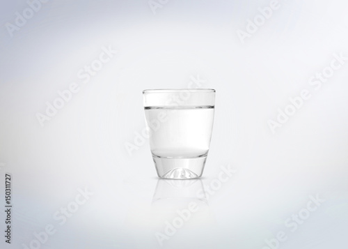 Silver shot of vodka, tequila, rum, schnapps, akvavit, pisco, cachaca or other alcoholic distilled beverage. Isolated on white background. photo