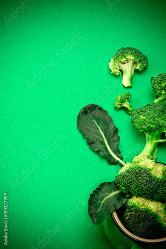 Fresh Broccoli on green background , nature green food concept