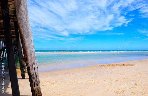 Beach jetty ocean point of view.