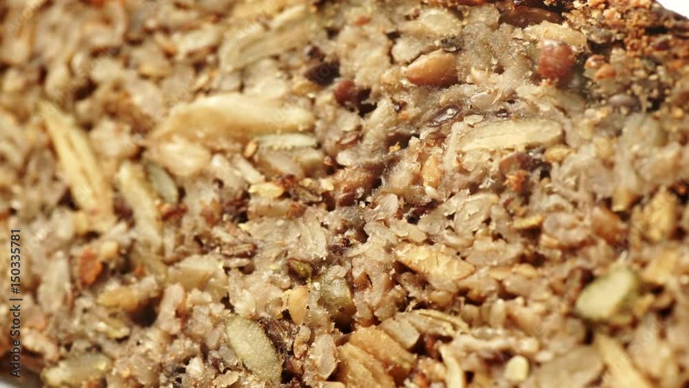 Nobody. Close up of homemade gluten free bread with seeds and nuts. Dolly slider shot 4K ProRes HQ codec Nobody. Close up of homemade gluten free bread with seeds and nuts. Dolly slider shot 4K ProRes HQ codec