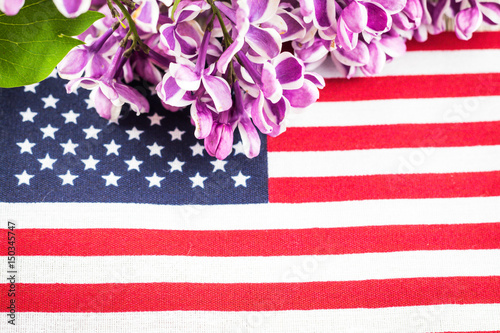 Fototapeta Naklejka Na Ścianę i Meble -  Fresh spring purple lilac and flag for spring and patriotic holidays