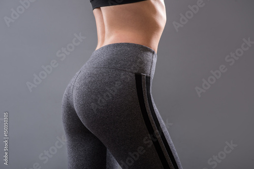 Perfect female buttocks of fitness girl photo