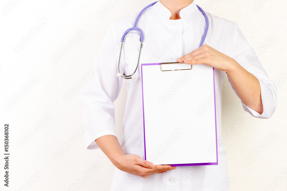 Doctor holding a tablet computer while using it isolated on white background Doctor holding a tablet computer while using it isolated on white background