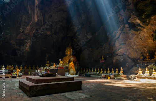 Sunbeam in buddha cave, Tham Khao Luang near Phetchaburi,Thailand photo