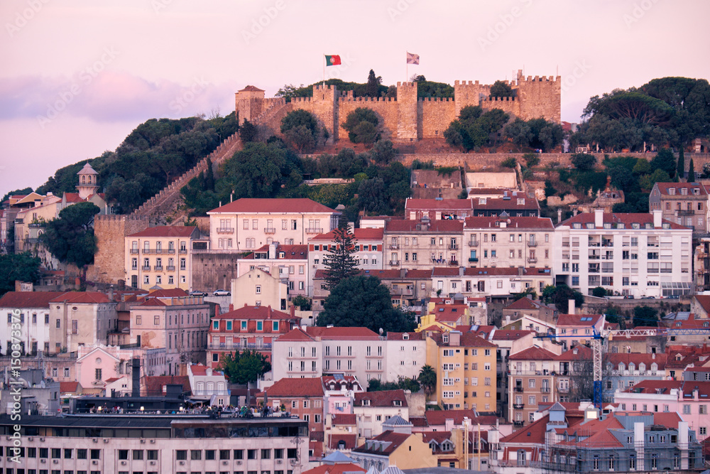 View of Lisbon in the evening with St Jorge Castle on hill