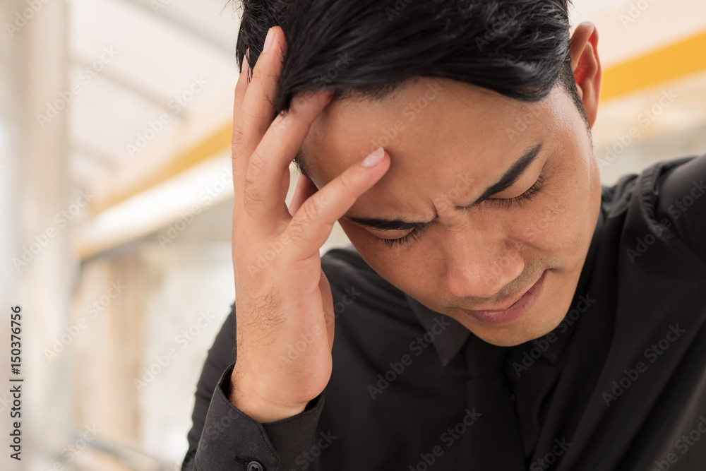 Fototapeta premium sick businessman suffering from stress, headache, vertigo, migraine, emotional problem