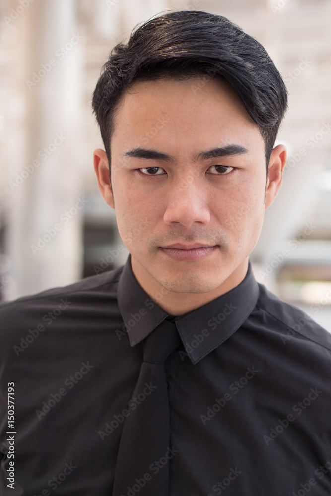 serious businessman looking at you serious businessman looking at you