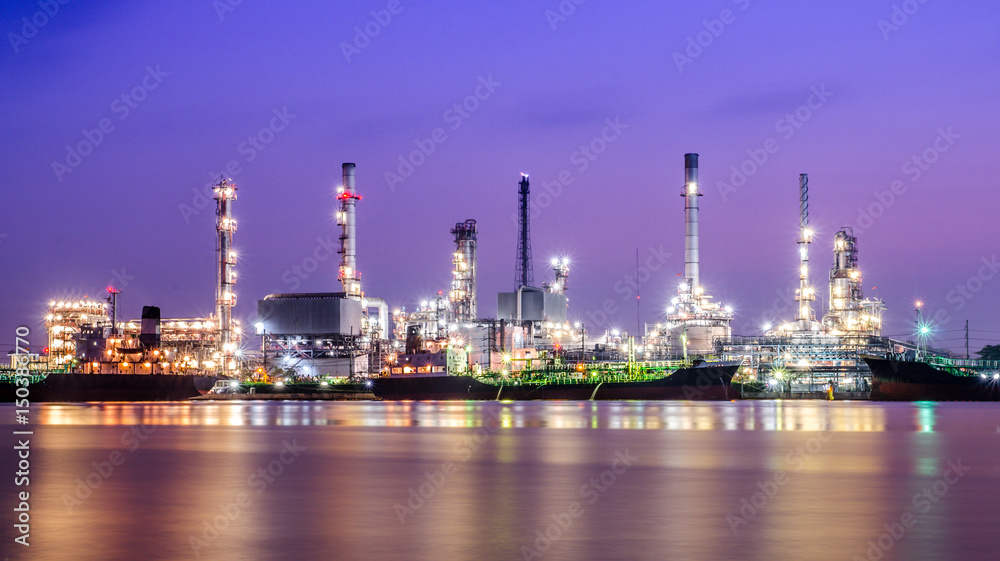 Refinery plant area at twilight with reflection (oil, refinery, industry)