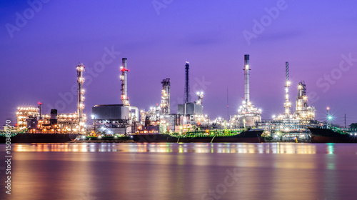 Refinery plant area at twilight with reflection (oil, refinery, industry)