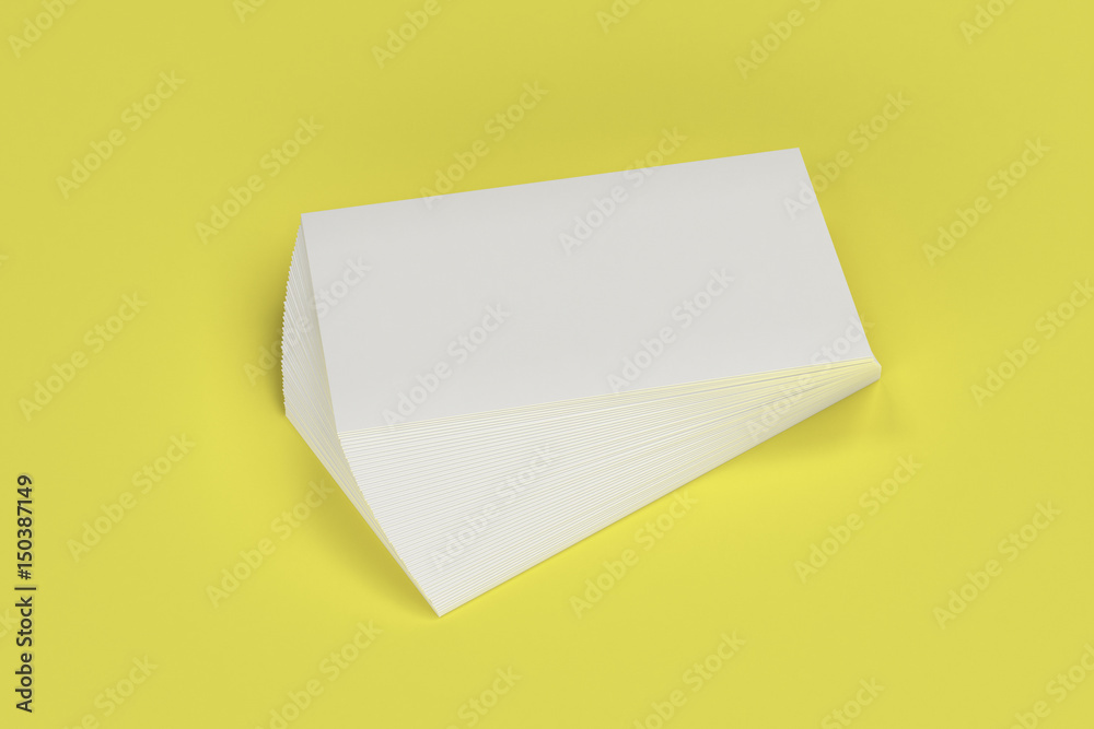White blank business cards mock-up on yellow background White blank business cards mock-up on yellow background