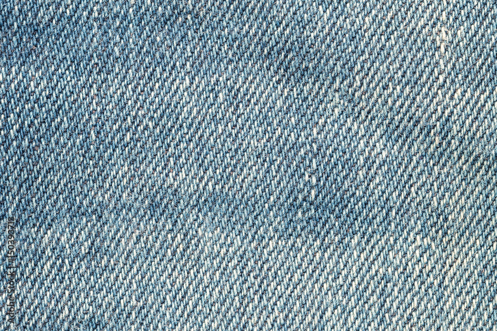 Closeup surface of old blue jean trousers fabric textured background Closeup surface of old blue jean trousers fabric textured background