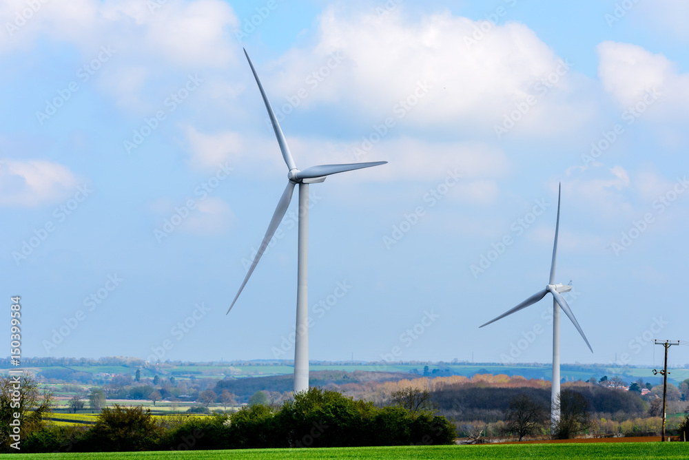 Wind Turbines and Blue Sky with Clouds over UK fields Wind Turbines and Blue Sky with Clouds over UK fields