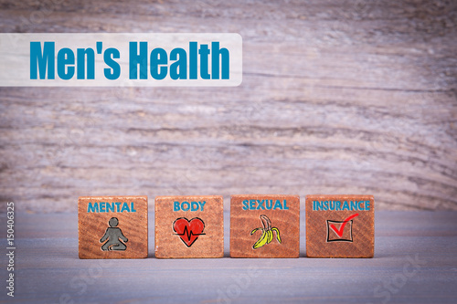 Men's Health concept. Wooden objects at a dark textured background.