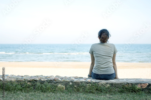 A girl looking at the beautiful beach.