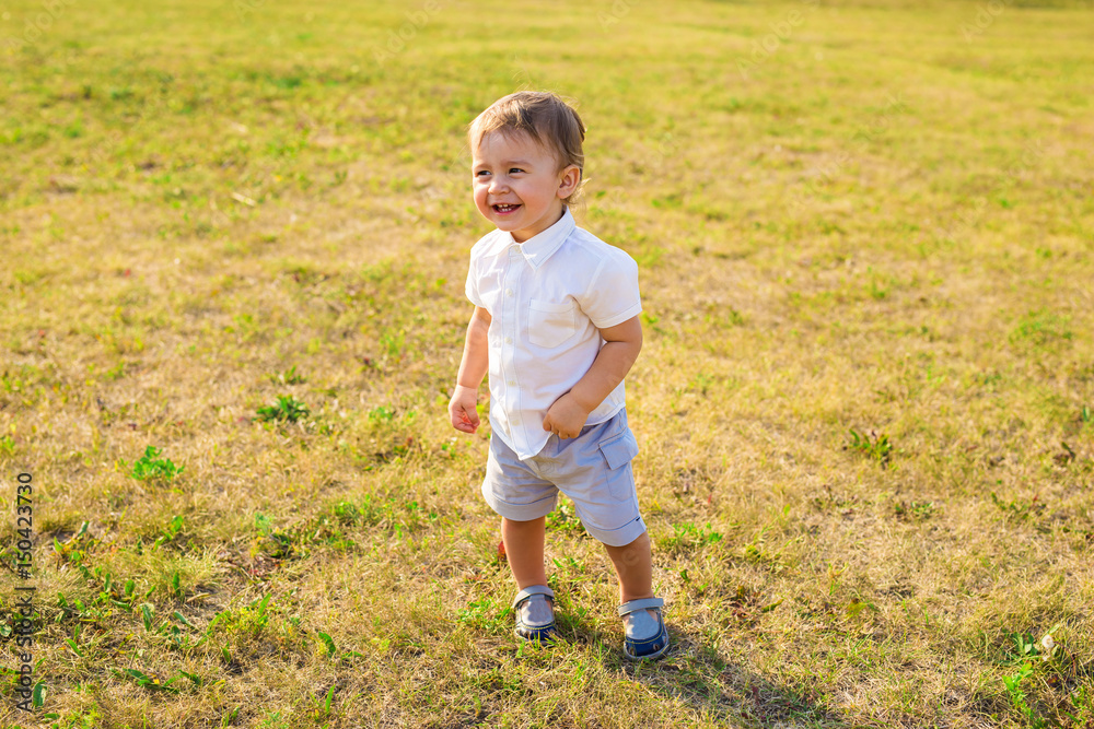 Happy laughing little boy playing in nature Happy laughing little boy playing in nature
