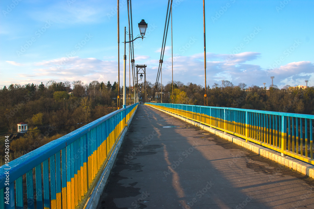 silhouette of people traveling across bridge