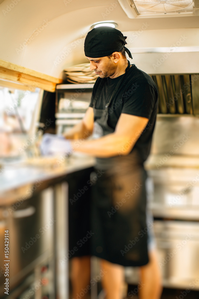 Man cooking in food truck