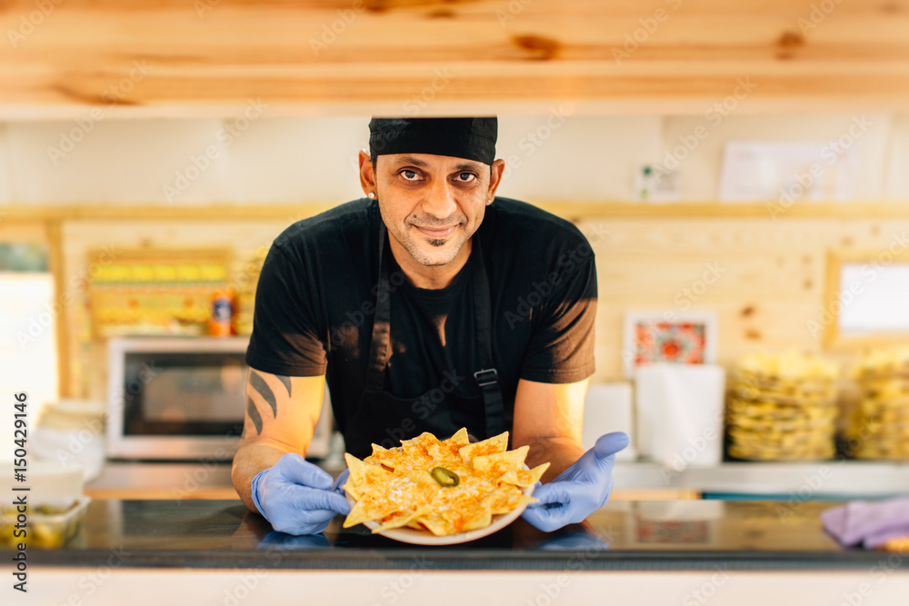 Smiling man with nachos