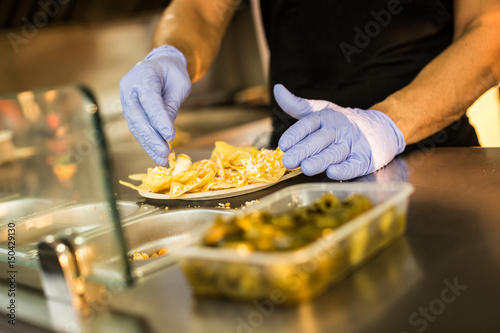 Chef preparing nachos in food truck