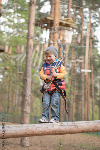 Gomel, Belarus - 30 April, 2017: Rope town for a family holiday in the countryside. Family competition to overcome aerial obstacles.