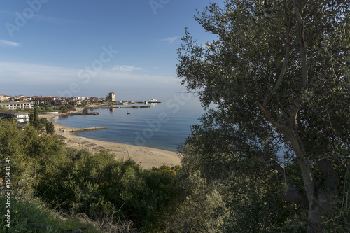 Panoramic view of a small coast town, with a golf, at the seaside; Greece, spring day