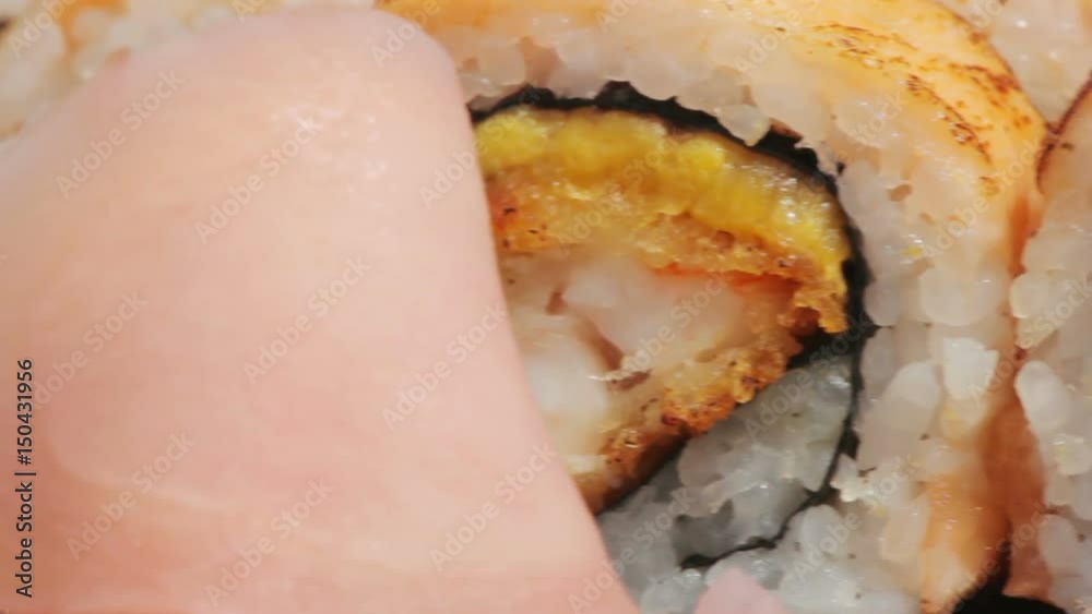 Macro salmon maki roll. sushi cuisine with fresh raw fish Macro salmon maki roll. sushi cuisine with fresh raw fish