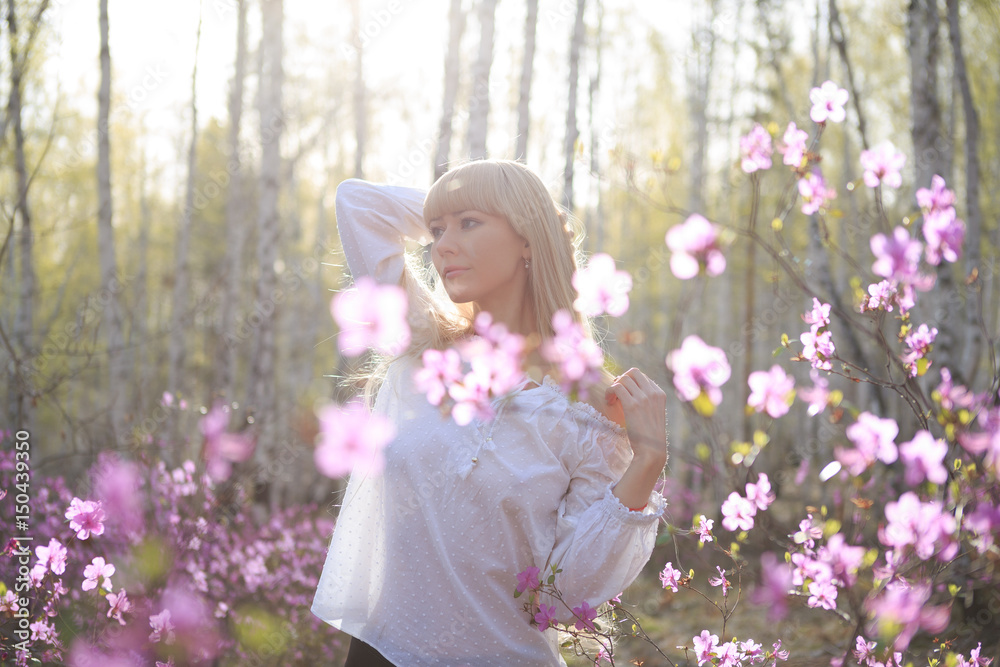 outdoor portrait of a beautiful middle aged blonde woman.