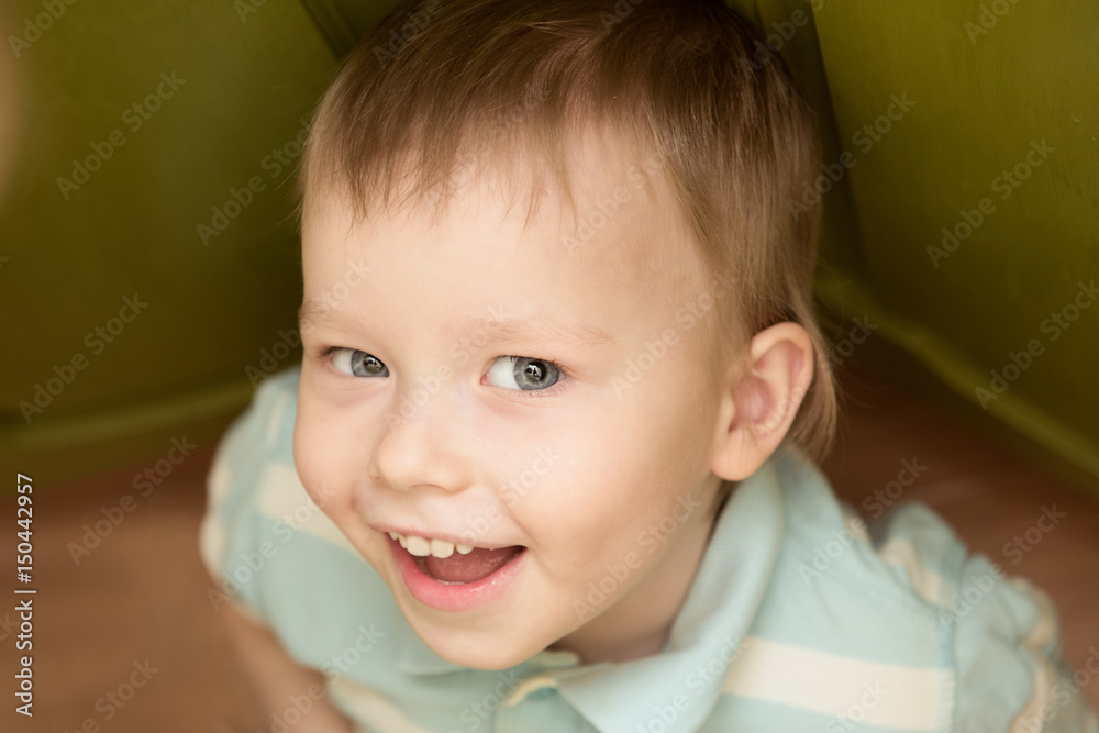 Handsome, beautiful caucasian smiling child