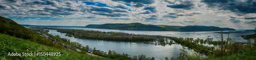 Panoramic view on Volga river and Zhigulevskie mountains in spring near Samara city, Russia © VarnakovR