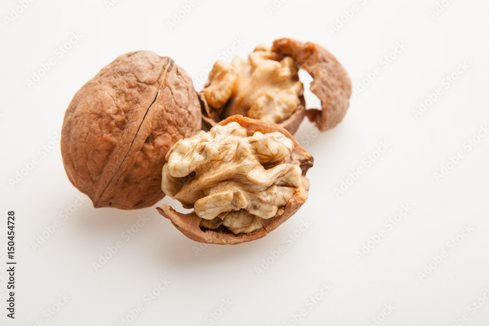Walnuts on a white background. Walnuts on a white background.