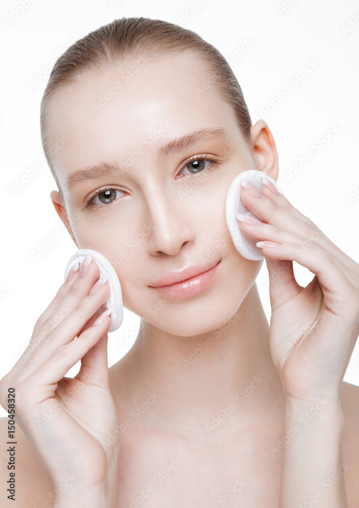 Beauty girl holding make up round puffs clean skin