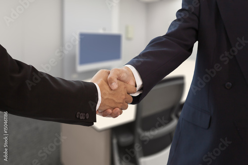 Bsuinessman hand shake in a meeeting room photo